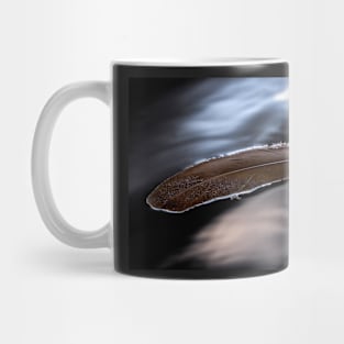 A Feather Floating on a Cold Lake Mug